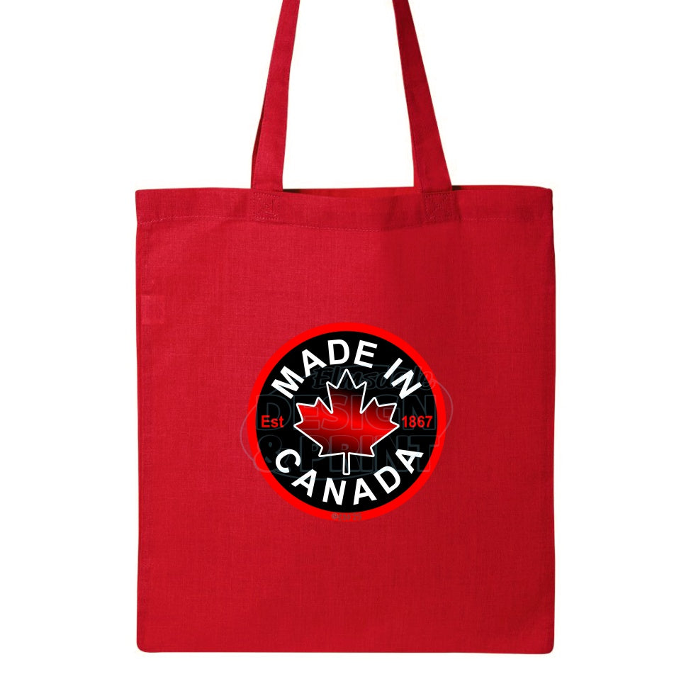 15x16" solid red canvas tote bag with Circular design with Made in Canada & a centered bright red maple leaf & Est.1867