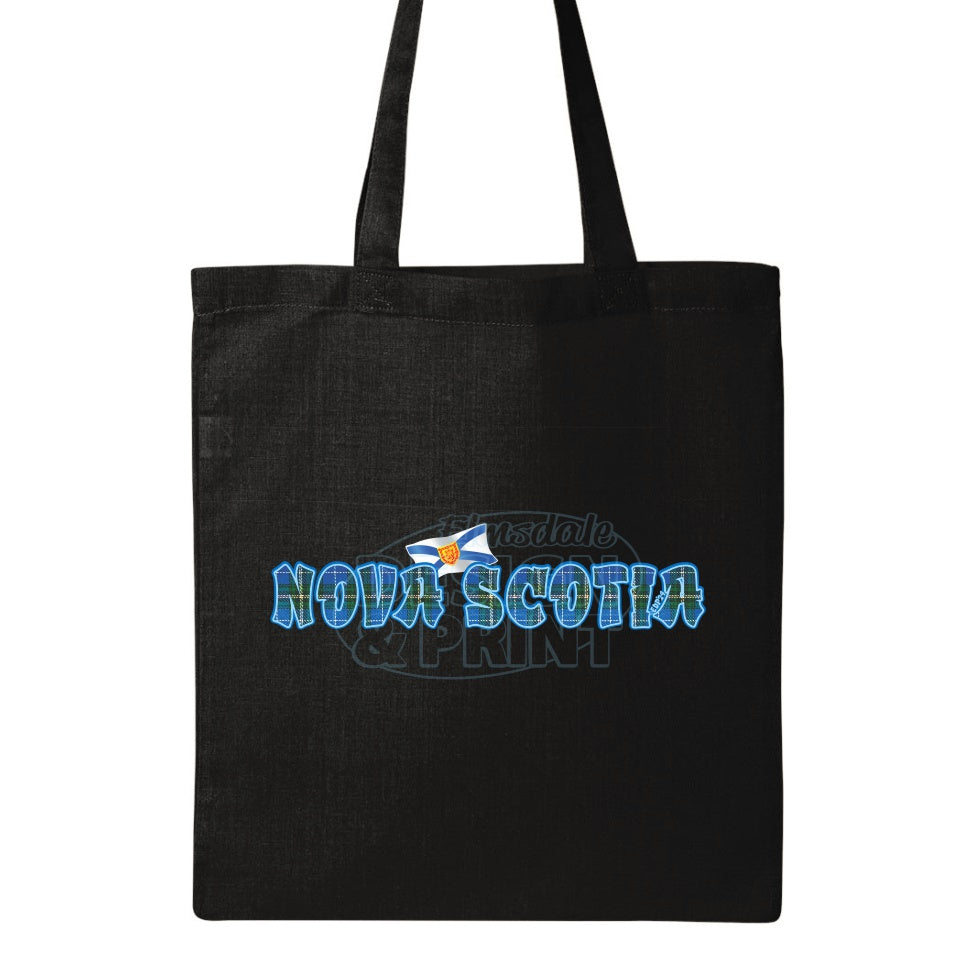 15x16" solid black canvas tote bag with Nova Scotia written in Blue Tartan with blue outlines & a Nova Scotia provincial flag