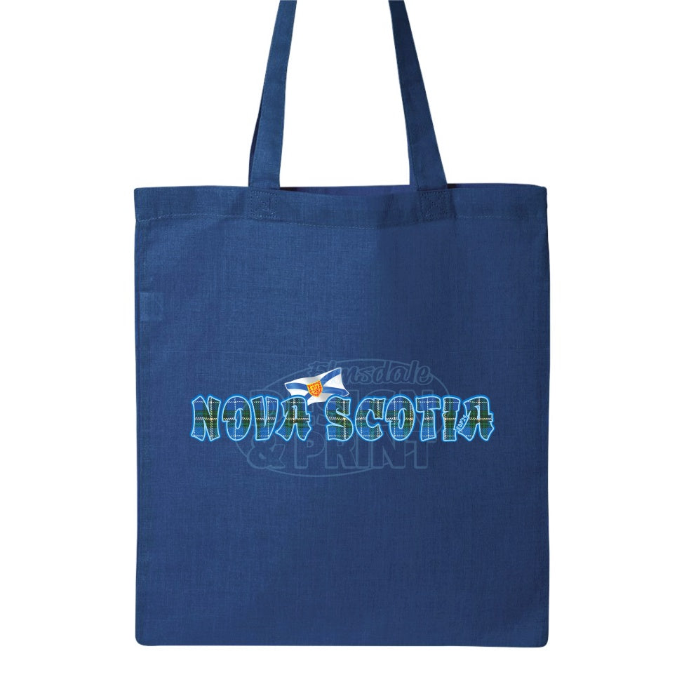 15x16" solid royal canvas tote bag with Nova Scotia written in Blue Tartan with blue outlines & a Nova Scotia provincial flag