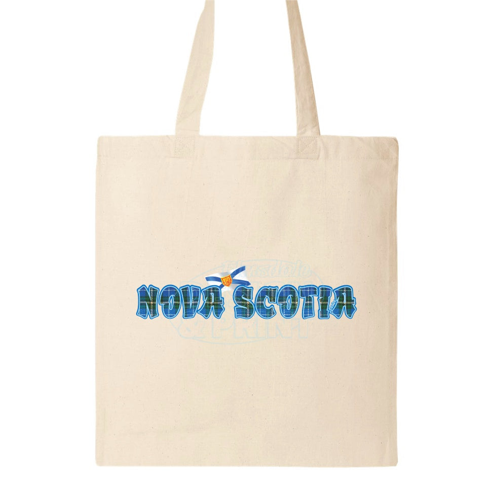 15x16" natural canvas tote bag with Nova Scotia written in Blue Tartan with blue outlines & a Nova Scotia provincial flag